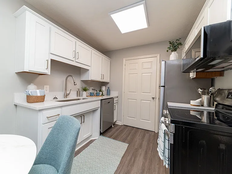 Kitchen with quartz counters and stainless appliances