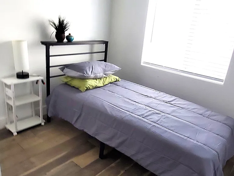 Another view of the second bedroom, highlighting the excellent natural light. A bright and airy space that feels welcoming and spacious. (Furniture not included).