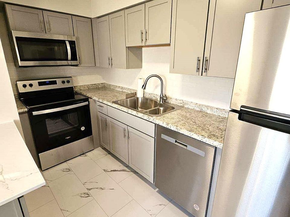 All Newer Kitchen: Stainless Appliances, Tile Flooring, Cabinets, Sink, Light Fixture, Island