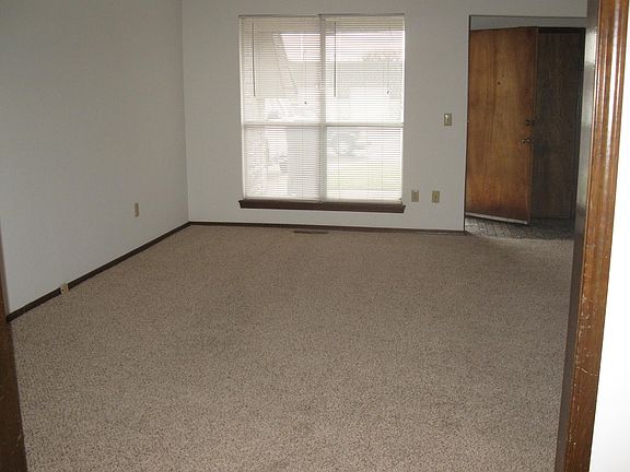 Spacious living room with great double windows facing front - large closet behind front door