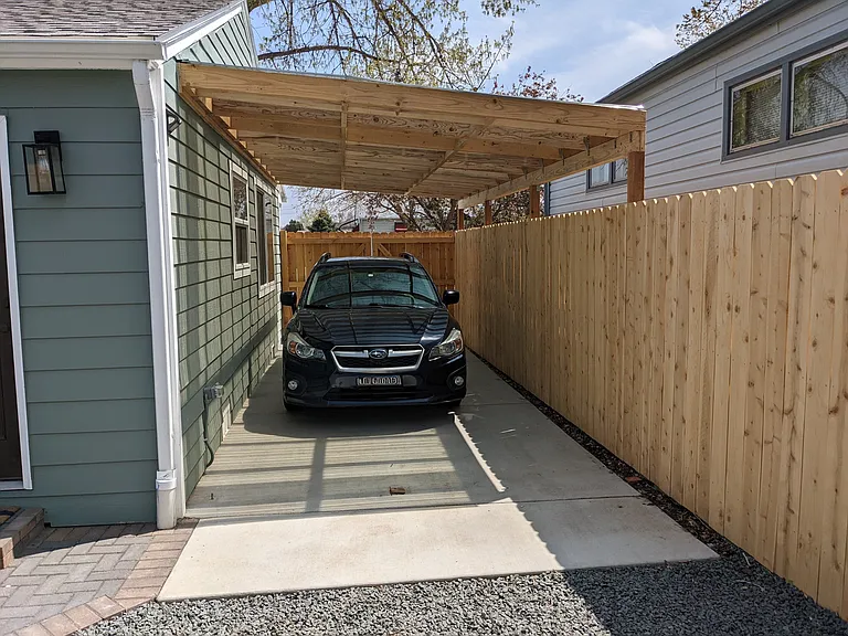 Ample carport provides convenient off-street covered parking