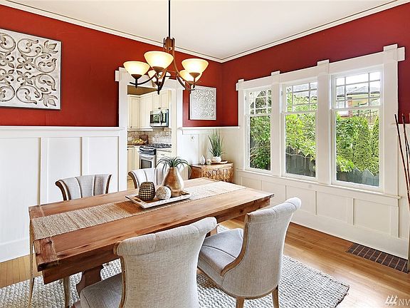 Dining room with chair panels and high ceilings 