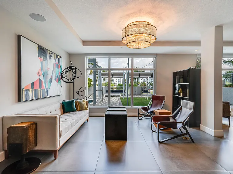 Lounge Seating with Sofa, Accent Chairs, and Large Windows