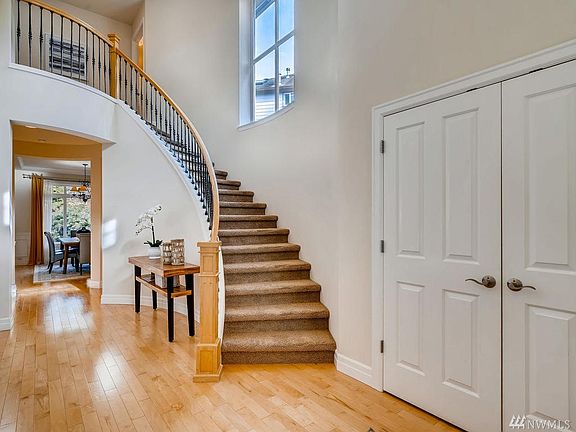 Soaring entryway with beautiful grand staircase
