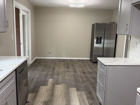 Side by side fridge. Would be relocated to the kitchen.