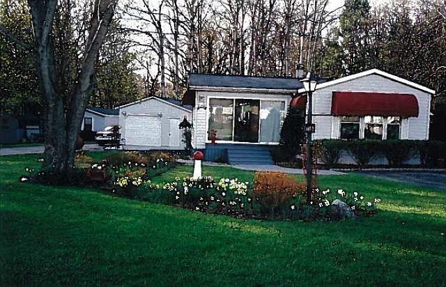 Front view of the corner lot
						:
						Large, landscaped, corner lot