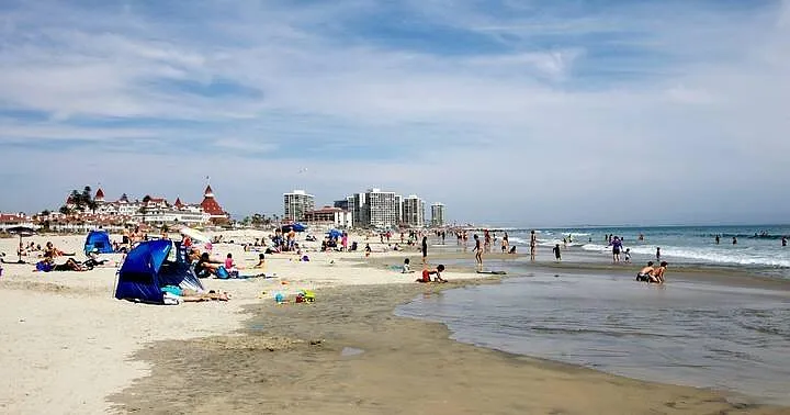 Swim, sunbathe, & surf in the Coronado Beach.