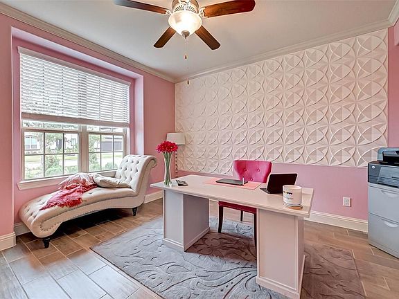 This exceptional study space is beautifully appointed with a vibrant wall paint, spotless flooring, and natural light that pours in!