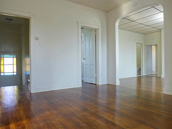 Living room. Stained glass window in front staircase