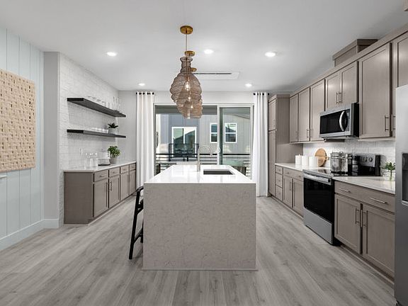 Kitchen leading into gathering room