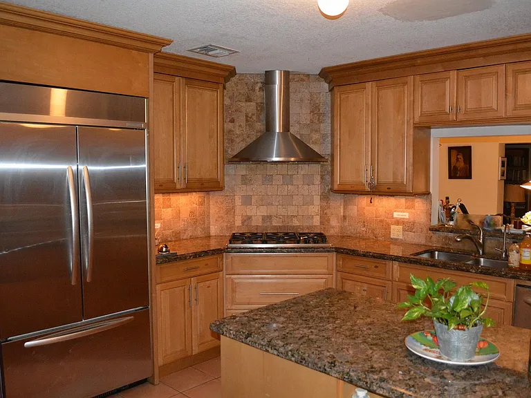 Full kosher kitchen with two sinks, two ovens, and two dishwashers