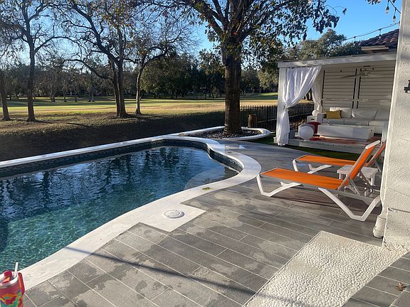 Cabana + pool + golf course view