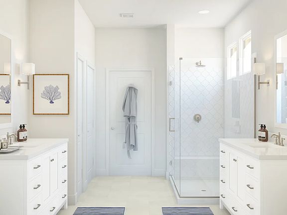 Primary bath with dual sinks and glass shower enclosure