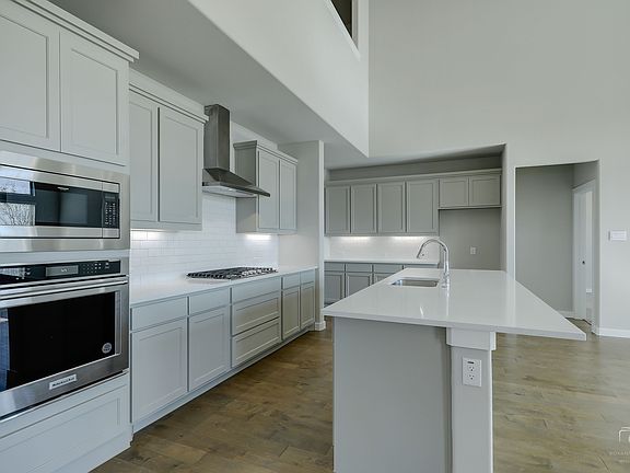 Kitchen in the Mercury home plan by Trophy Signature Homes - REPRESENTATIVE PHOTO