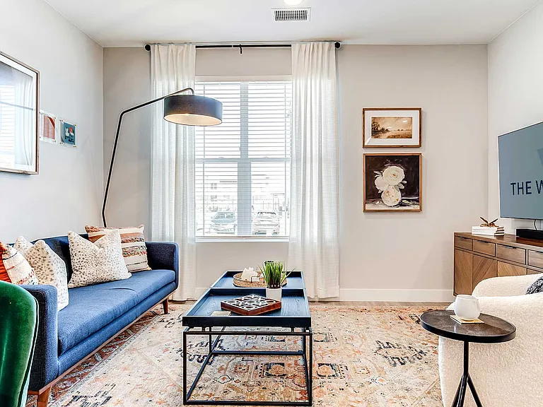 Bright and inviting living spaces at The Wright feature oversized windows, contemporary finishes, and open layouts designed for both relaxation and entertaining.