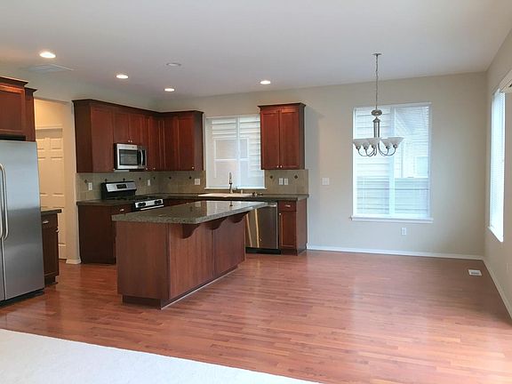 Cherry kitchen with granite and stainless appliances, has a seperate large pantry