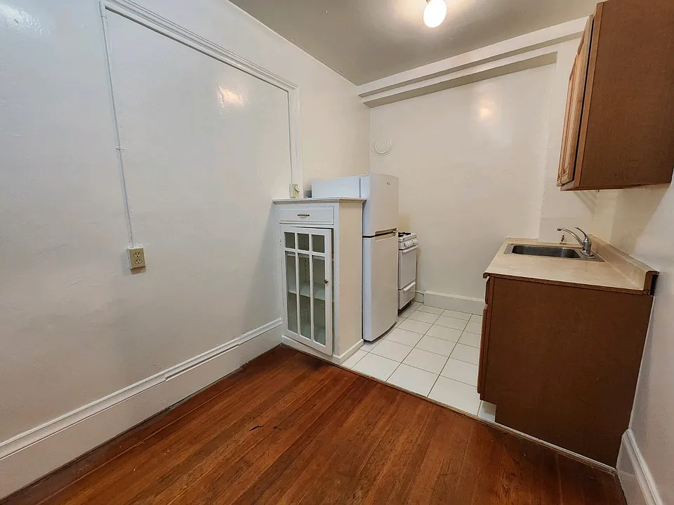 Kitchen with view of dining area and appliances