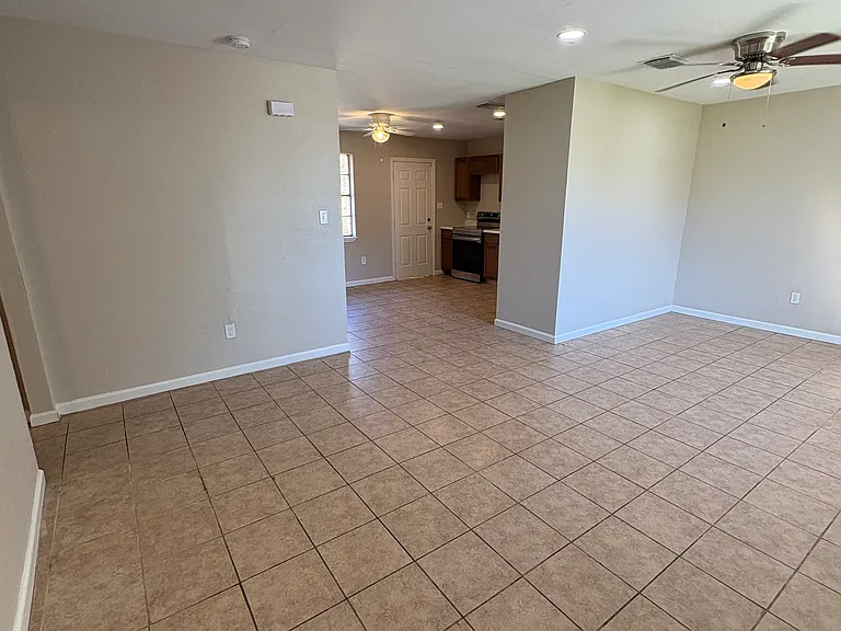 Large living room with open floor plan to the kitchen and dining room.