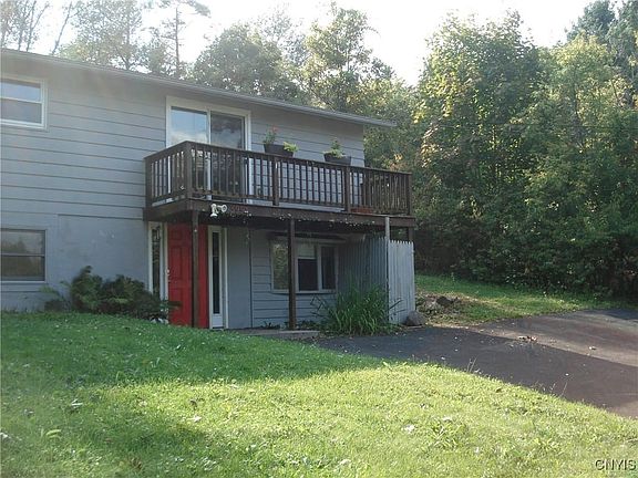 Front with driveway to entrance