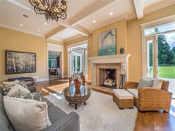 The great room boasts a classic French Chiefs kitchen, With a antique finish,butcherblock island Miele, Wolf, and Subzero appliances!