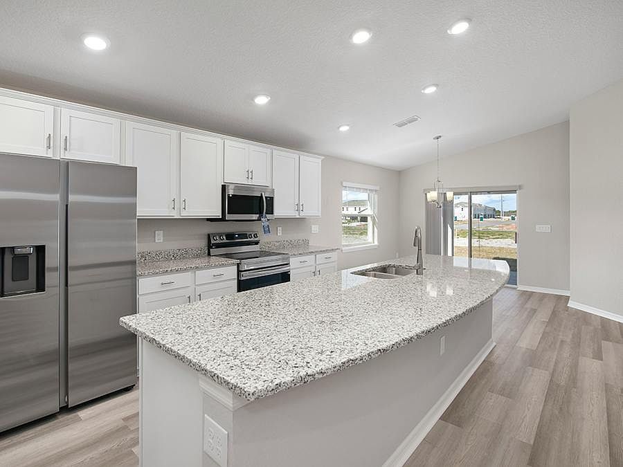 Sunny, open-layout 4-bedroom home for sale in Parrish, Florida, on a premium waterfront homesite!