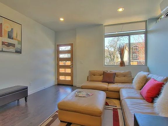 Looking back at front door in living/TV Room