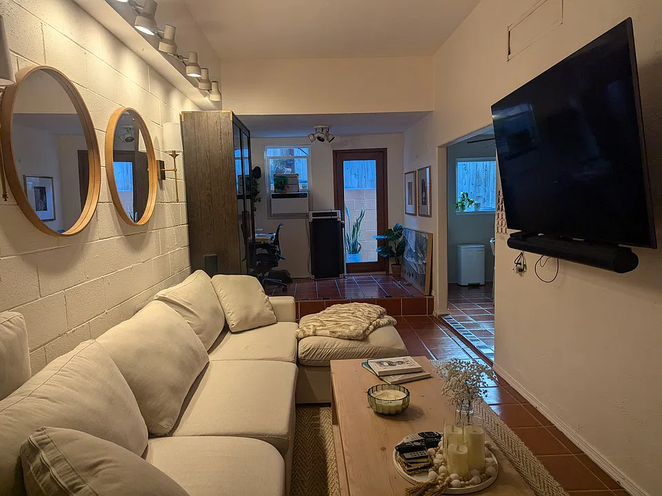 Living room facing kitchen and back patio door