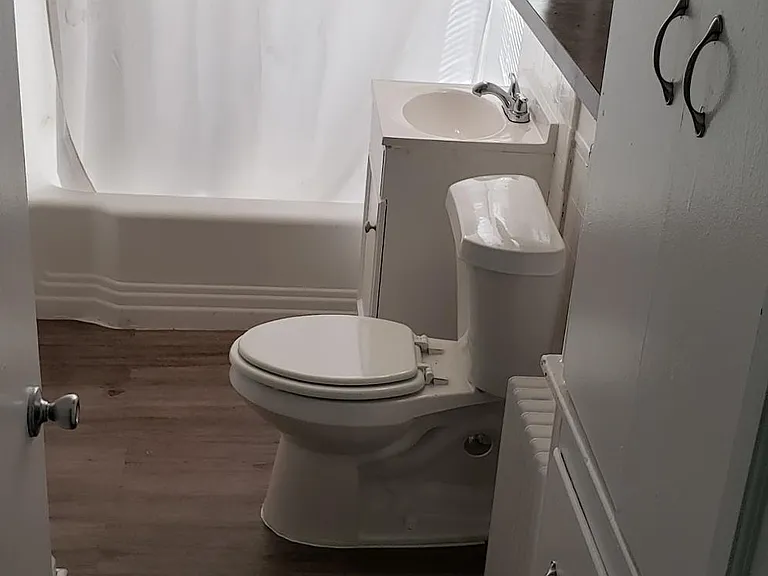 Bathroom with ample storage and linen closet.