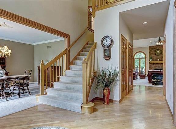 Custom designed open floor plan with beautiful wood floors, trim and doors.