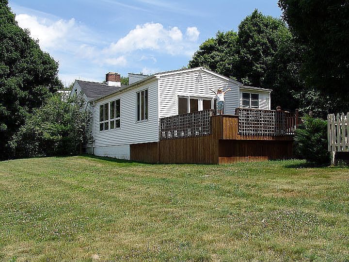 Rear Side Yard showing back deck (pool fence at right)