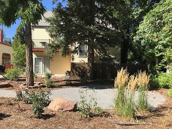 Common area in front of condo & enclosed, shaded private patio.
