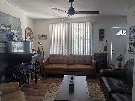 This is the living room view from the dining room facing the front entry.