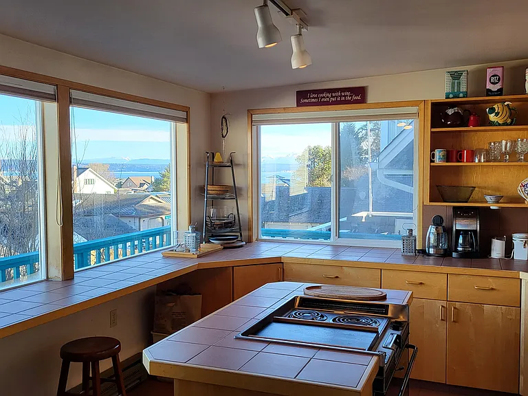 Full kitchen with oven, 2 burners, microwave, refrigerator/freezer, and dishwasher