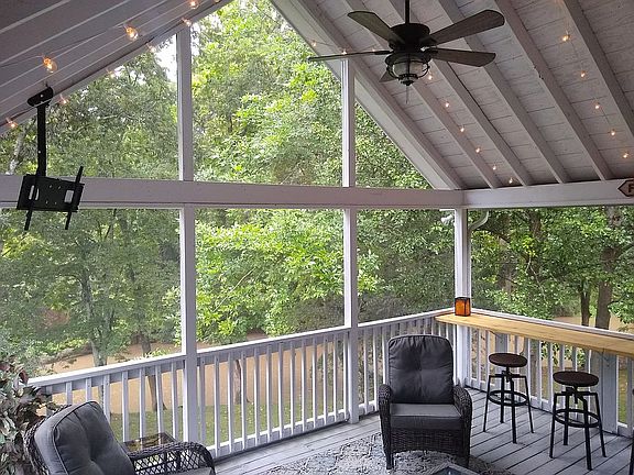 Screened in deck w/creek view