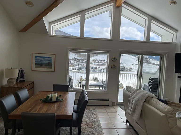 View of Lake Dillon out open kitchen-living-dining room and back deck.