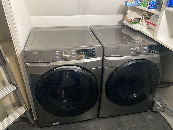 pantry with washer/dryer and many shelves