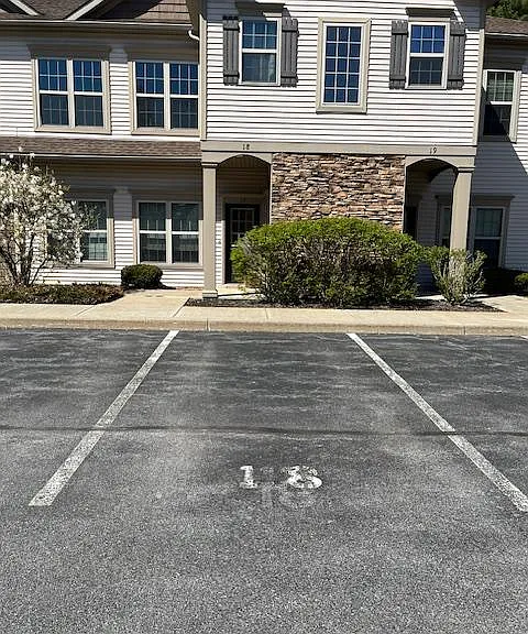 Front entrance with parking spot