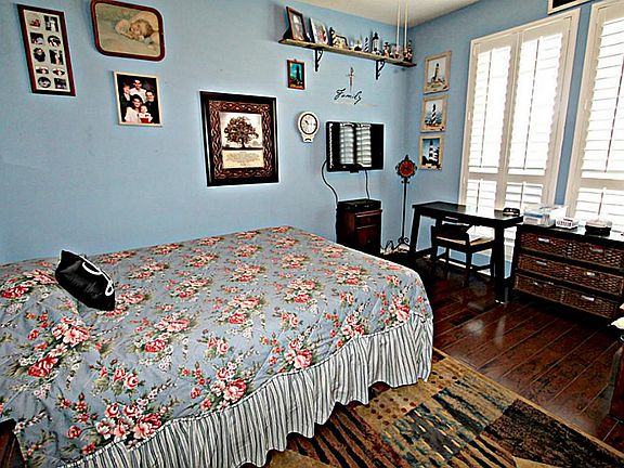 WORKING FROM HOME HAS NEVER BEEN SO EASY IN THIS STUDY OFFERING PLANTATION SHUTTERS AND HARDWOOD FLOORS