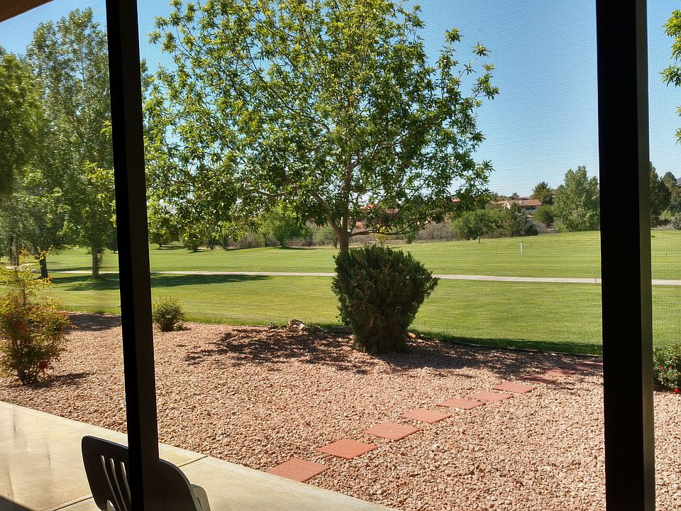 View from screened patio across 18th fairway