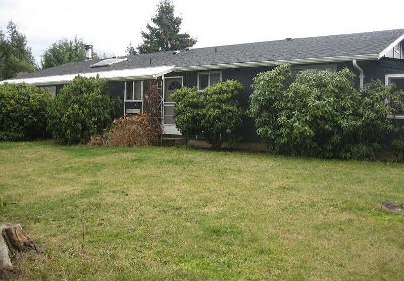Front of house, with mature plants
