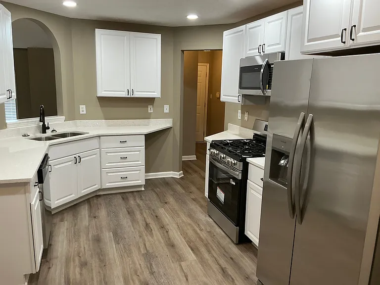 White cabinetry and quartz countertops
