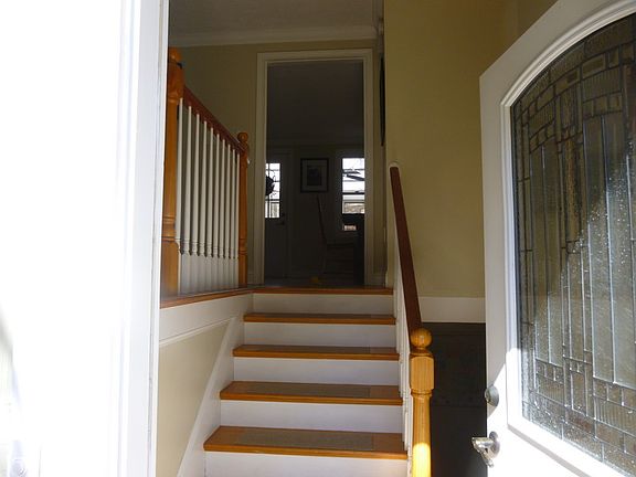 Front entry foyer - Come right in!
						:
						Enter split foyer. Up into living room and through kitchen door or down.
