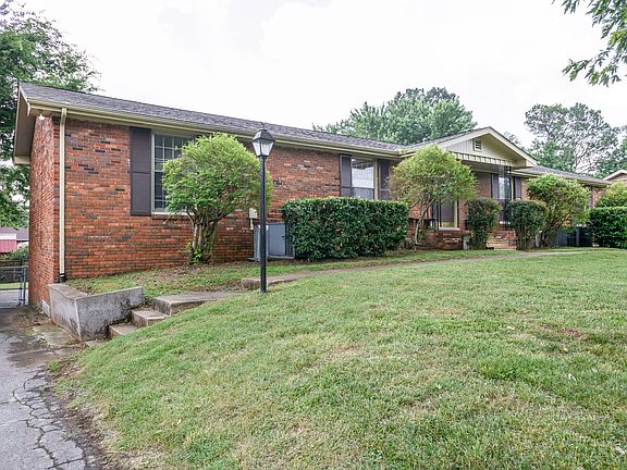 View from the side of the house and this duplexes driveway, the garage is located at the back of the house