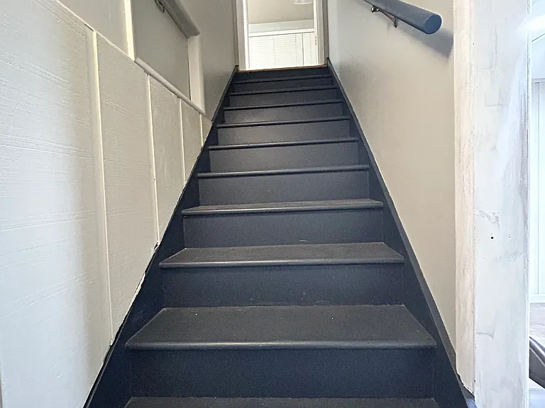 Interior stairs connecting upstairs and downstairs. Has a lockable door for privacy.