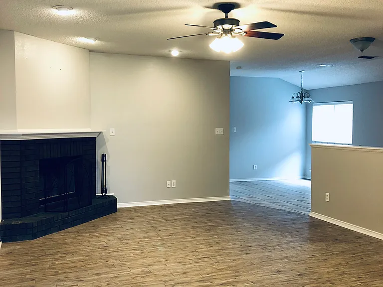 Open concept to kitchen and dining. Beautiful light gray scheme. Warm and inviting!!