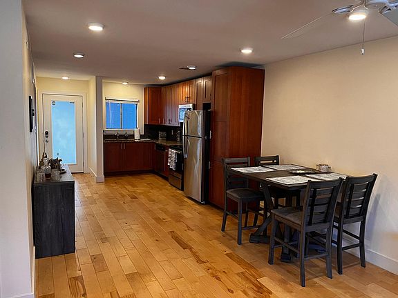 The open-concept kitchen gives a roomy feel as it blends with the living room space.