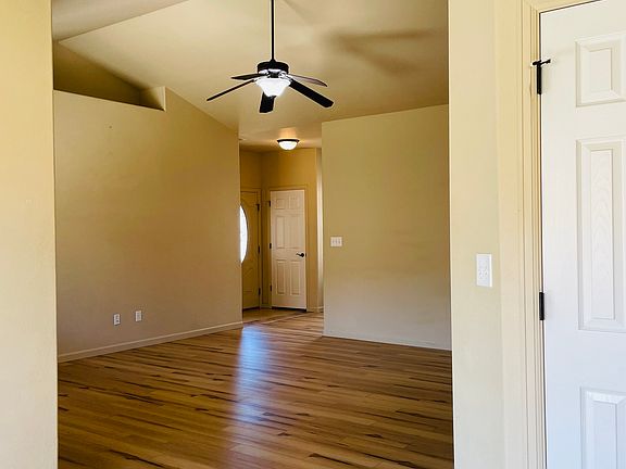 Living room view from kitchen to front entry