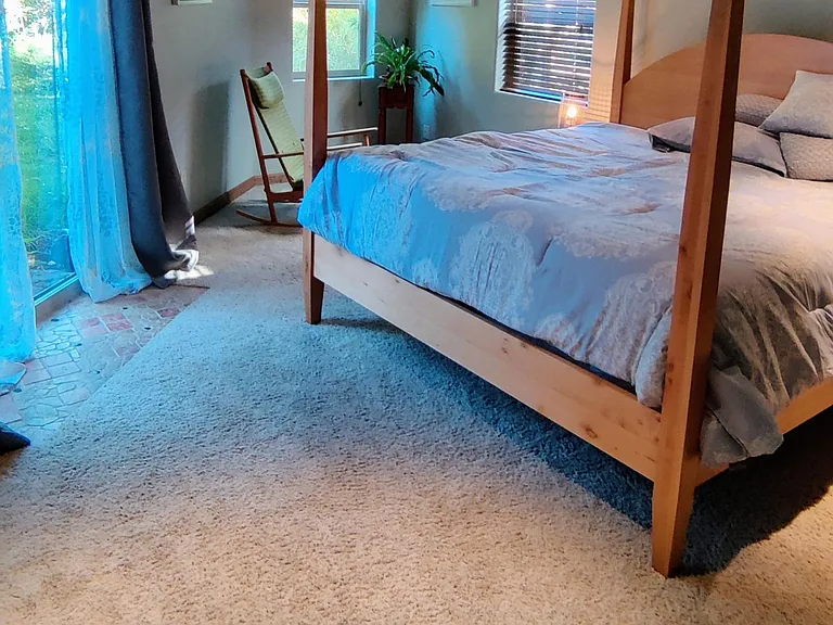 Huge master bedroom with garden views.