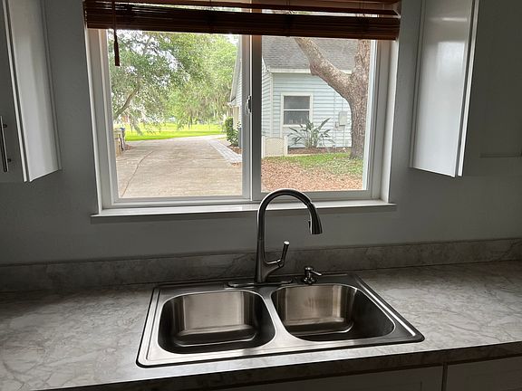 There is a beautiful view right outside the kitchen window. You can easily see your parked car in front from this window.