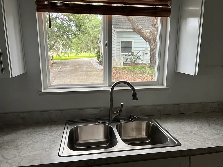 There is a beautiful view right outside the kitchen window. You can easily see your parked car in front from this window.